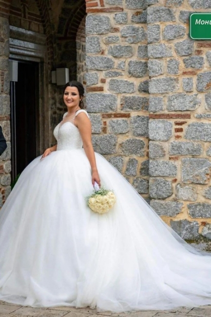 Robe de mariée princesse en pailletttes traîne épaisseurs chic